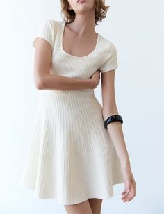 Introducing our Summer French White Skating Knitted Mini Dress – a charming and versatile addition to your warm-weather wardrobe. This dress captures the essence of French fashion with its elegant design, short sleeves, and playful knitted texture, making it perfect for summer outings and casual events.The French-inspired design brings a touch of timeless sophistication to this mini dress, while the knitted texture adds a playful and trendy element. The short sleeves make it ideal for staying cool in the summer heat, and the skating silhouette ensures a flattering fit for various body types.Crafted from high-quality knitted fabric, this mini dress guarantees both comfort and style. Whether you're enjoying a day of leisure, heading to a casual gathering, or simply strolling through the city Twist Short, French Dress, Spring Break Outfit, Early Spring Outfits, Spring Fashion Outfits, Mini Skater Dress, Round Neck Dresses, Pleated Maxi Dress, Crewneck Dress