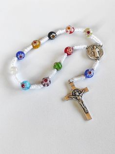 NEW - UNIQUE - Medjugorje Catholic Bracelet Decade Rosary Murano Crystal Glass Rosaries. This Decade Rosary Bracelet is made from the Murano Crystal Glass. Size beads 8mm. This Rosary can be perfect for a gift and it comes from Medjugorje. Feel free to ask any questions pertaining to this item. Thank you. I Have some more and different Rosaries, if You like to have some more please contact me. I Shipp Worldwide - White Rosary Bracelet With Colorful Beads, White Colorful Beaded Rosary Bracelet, White Bohemian Rosary Bracelet With Round Beads, Catholic Bracelet, Decade Rosary, St Benedict, Rosary Bracelet, Rosary Beads, Murano Glass