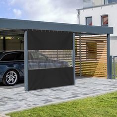 a car is parked in front of a house with a carport attached to it