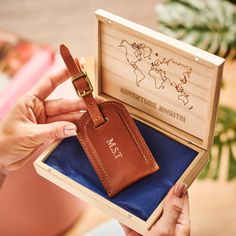 Looking for the perfect gift for someone who loves to travel? Our handmade leather luggage tag is made into a wonderful, luxurious and thoughtful gift with the addition of your unique personalisation - and the wooden gift box can be engraved with your personal message at no extra cost. The wooden box is engraved with the world map and then you can choose your message underneath. The wooden box is tied with ribbon. Each of our leather luggage tags is handmade using our signature buffalo leather a Engraved Wooden Boxes, Personalised Wooden Gifts, Laptop Pouch, Leather Luggage Tag, Leather Engraving, Engraved Box, Travel Luggage Tag, Leather Luggage Tags, Wooden Gift Boxes