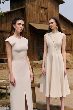 Miery Sheath Round Neck Twill Midi Dress | MEAN BLVD Modern H-line Party Dress, Elegant Asymmetrical Beige Dress, Sleeveless Dress With Flattering Cut For Formal Occasions, Formal Sleeveless Dress With Flattering Cut, Elegant Asymmetrical Beige Maxi Dress, Elegant Sleeveless Dress With Side Slits For Party, Spring Knee-length Midi Dress With Split Design, Elegant Beige Asymmetrical Maxi Dress, Elegant Beige A-line Sleeveless Dress