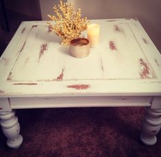 a white table with some candles on it