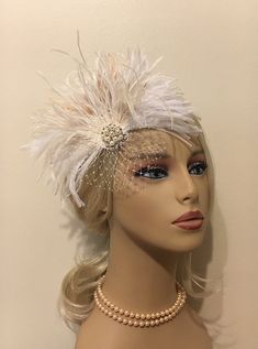 "Wedding Hair Accessory Bridal Headpiece Bridal Fascinator Headpiece Wedding Headpiece Flapper Headpiece Wedding Hair Piece Hairpiece Shades of off white, ivory and champagne feathers with a delicate poof of ivory french net tulle and pearl and rhinestone center. Perfect if you want to go without a veil, very chic! Your choice of having it made with a wire hair comb or an alligator clip with teeth. ~White ostrich feathers~ ~Ivory Ostrich Trim Feathers~ ~White Ostrich Trim Feathers~ ~Ivory/Champa Vintage Wedding Headband Headpiece, Vintage Pinched Crown Headpiece For Weddings, Vintage Wedding Headpiece With Pinched Crown, Vintage Wedding Fascinator Headband, Vintage Wedding Headband Fascinator, Vintage Wedding Headband, Gatsby Style Mini Hat Headband For Weddings, Adjustable Fascinator For Wedding, Adjustable Crown Wedding Headpiece