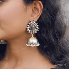 Enhance your look with Mayura jumkis, featuring an elegant oxidized finish complemented by rich 22kt gold plating. These earrings merge classic charm with a contemporary edge, offering a sophisticated accessory that stands out with every wear. Silver Jhumkas, India Inspired, Tarnished Silver, Earring Necklace, Gold Plating, Shop Earrings, Silver Earrings, Gold Plate, Silver Rings