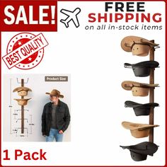 a man standing in front of a wall mounted hat rack with five hats on it