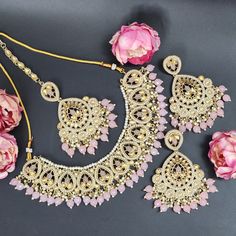 Elevate your elegance with our exquisite Baby Pink Indian Asian Bollywood Jewelry Set. This captivating bridal choker fashion necklace, paired with stunning earrings and a delicate tikka, exudes timeless charm fit for a wedding or any special occasion. Crafted with precision, this set showcases intricate detailing and the delicate hue of baby pink, adding a touch of ethereal beauty to your ensemble. Designed to complement the grace of women, this jewelry set is more than adornment; it's an expre Pink Wedding Necklaces With Matching Earrings, Pink Necklaces With Matching Earrings For Wedding, Pink Bridal Necklace With Matching Earrings For Wedding, Elegant Pink Bridal Sets For Party, Pink Dangle Necklaces For Wedding, Hand Set Jewelry Sets For Wedding, Elegant Kundan Dangle Necklace For Wedding, Pink Wedding Choker Jewelry, Pink Elegant Jewelry For Wedding