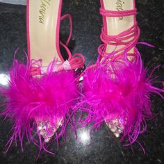 Beautiful Pink Sandal With Feathers That Strap Around The Ankles Pink Ankle Strap Sandals For Party Season, Pink Sandals With 4-inch Heel For Evening, Pink Heel Strap Heels For Party, Pink Sandals For Formal Parties, Pink High Heel Heels For Party Season, Pink Formal Sandals For Party Season, Glamorous Pink Sandals For Night Out, Glamorous Pink Sandals For Party, Chic Pink Heels For Party Season