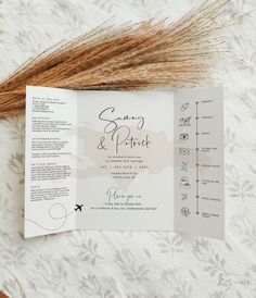 an open wedding program on top of a white sheet with brown hair in the foreground