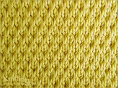 close up view of yellow knitted fabric