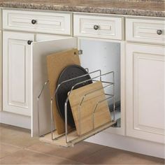 an open dish rack in the middle of a kitchen