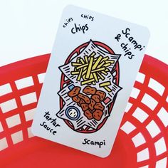 a close up of a card with food on it in a red basket next to a white background