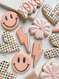 decorated cookies are arranged on a table