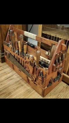 an old wooden tool box filled with lots of different types of woodworking tools on top of a hard wood floor