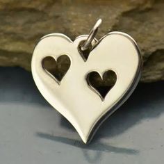 Cute, simple, and sweet, this heart cut out charm is perfect for the mother of two. Each heart can represent someone you love or someone special. Fairytale Food, Heart Cut Out, Travel Charms, Beading Tools, Halloween Charms, Two Hearts, Feather Charms, Love Charms, Luck Charms