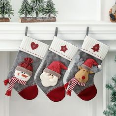 three christmas stockings hanging from a mantel