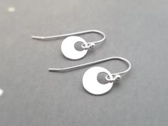 These earrings are a perfect match for any necklace, and are great for every day wear!An ultra shiny 10mm sterling silver teardrop hangs from sterling silver french (fish hook) earwires.  The total length of these earrings is aprox 3/4".  The earring shown on the model is not this exact earring, but a similar style that can also be found in my shop.  These earrings are also available on leverback style earwire (last picture).Find more of my items here: https://www.etsy.com/shop/IDreamofJewelry?r Dragonfly Earrings, Small Circle, Silver Bow, Lovely Earrings, Fish Hook, Organza Bags, Beautiful Earrings, Perfect Match, Jewelry Inspiration