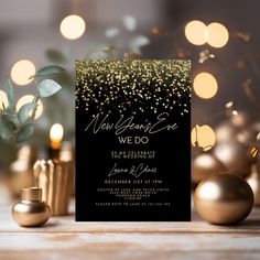 a black and gold new year's eve party card