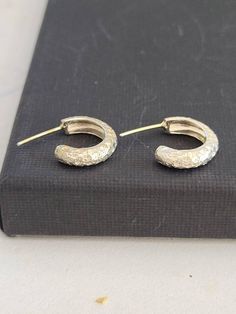 These  are sterling silver delicate earrings. Small  hoop earrings. Textured earrings. Its a great gift for women and teens. Great present for the holidays or for yourself. great bridal and wedding earrings.-Sterling silver-Free shipping worldwide-All my jewelry are sent in a gift boxTo see more of my hoops, please follow this link: https://www.etsy.com/your/shops/TamyZurTachshit/tools/listings/section:25644741,stats:trueTo see more of my Earrings. please follow this link:https://www.etsy.com/il Small Hoops Earrings, Real Gold Hoop Earrings, Earrings Small Hoops, Hippie Chic Jewelry, Textured Earrings, Earrings Small Hoop, Wedding Hoop, Large Silver Hoop Earrings, Handmade Hoop Earrings