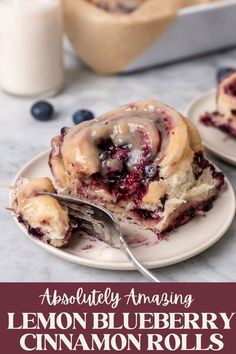 blueberry cinnamon rolls on a plate with a fork