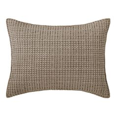 a brown and white pillow with a checkered pattern on the front, sitting against a white background