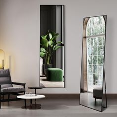 a large mirror sitting in the middle of a room next to a chair and table