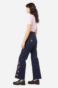 Paisley embroidered flare jean- ornamental paisley swirls embroidered on leg hem and back pockets- a trendy flare fit for this season in a rich dark denim- high rise style- front fly with button closure- side and back pockets- comfortable cotton elastane blend- available in dark denim Product Code: PGFX017 Embroidered Wide Leg Denim Blue Jeans, Spring Embroidered Denim Blue Flare Jeans, Embroidered Wide Leg Denim Jeans, Fall Embroidered Denim Flare Jeans, Embroidered Denim Flare Jeans For Fall, Spring Embroidered Wide Leg Flare Jeans, Embroidered Wide Leg Flare Jeans For Spring, Denim Blue Floral Embroidery Wide Leg Jeans, Trendy Floral Embroidered Wide Leg Bottoms