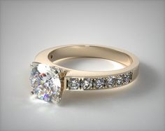 a white gold engagement ring with diamonds on the side