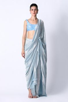 Ice blue pre draped saree in a textured base. Comes with sequin embellished blouse.
Components: 2
Pattern: Textured,Embellished
Type Of Work: Sequin
Neckline: Round
Sleeve Type: Sleeveless
Fabric: Silk, Foiled Net
Color: Blue
Other Details: 
Built in petticoat
Closure: Blouse: Back closure
Occasion: Cocktail,Reception - Aza Fashions Festive Silk Pre-draped Saree With Sequins, Blue Tissue Silk Pre-draped Saree For Reception, Glamorous Silk Pre-draped Saree With Mirror Work, Glamorous Designer Draped Lehenga, Glamorous Draped Designer Lehenga, Festive Blue Pre-draped Saree With Sequins, Blue Sequined Pre-draped Saree For Party, Blue Draped Silk Saree, Glamorous Draped Lehenga With Unstitched Blouse