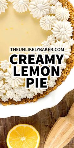 a lemon pie on a wooden table with the words creamy lemon pie in front of it