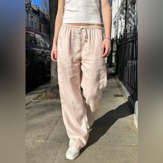 Wide Leg Fit Pants With A Drawstring Waist, And Side Pockets. Fabrics: 100% Linen Measurement: 11" (28 Cm) Rise, 28" (71 Cm) Inseam, 26" (66 Cm) Waist (Stretches) Made In: China Pink Brandy Linen Pants, Brandy Pink Linen Pants, Pink Relaxed Fit Linen Bottoms, Pink Linen Bottoms For Spring, Casual Pink Linen Pants, Pink Relaxed Fit Linen Pants, Pink Linen Pants With Pockets, Pink Linen Straight Pants, Brandy Melville Rosa Sweatpants