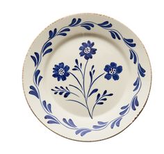 a blue and white plate with flowers painted on it's rim, isolated against a white background