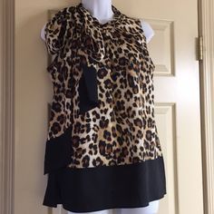 New York And Company Cheetah Print Sleeveless Blouse. Size Small Can Be Worn With Jeans Or Under A Jacket For Business Attire Leopard Print Summer Workwear Top, Summer Workwear Leopard Print Tops, Summer Leopard Print Tops For Workwear, Leopard Print Tops For Summer Workwear, Summer Leopard Print Top For Work, Casual Leopard Print Sleeveless Tank Top, Casual Sleeveless Leopard Print Top, Chic Leopard Print Sleeveless Top, Stretch Sleeveless Leopard Print Top