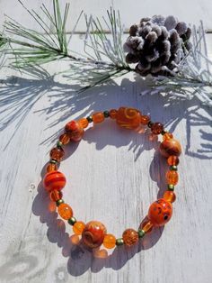 Orange beaded stretch bracelet. We used various orange, brown, silver and gold beads for these bracelets. 8 inches long, best for an average wrist to larger wrist. Great boho style. Chinese Bracelet, Bracelet Aesthetic, Orange Bracelet, Picnic Date, Brown Silver, Boho Stil, Beaded Stretch Bracelet, Style Boho, Orange Brown