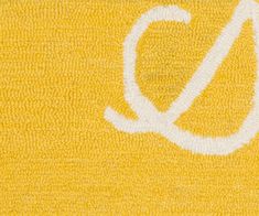 a yellow towel with the letter q on it