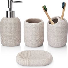 three pieces of bathroom accessories including soap dispenser, toothbrush holder and soap dish