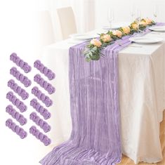 the table is set with purple linens and place settings