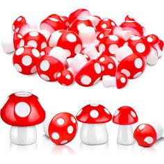 many red and white mushrooms are shown in this image, with one mushroom surrounded by smaller ones