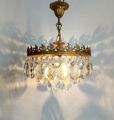 a chandelier hanging from the ceiling in a room