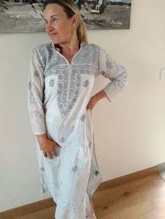 Hand embroidered cotton tunic White Tunic With Chikankari Embroidery, Bohemian Tunic With Chikankari Embroidery, White Bohemian Tunic With Chikankari Embroidery, Bohemian Straight Kurta Tunic With Chikankari Embroidery, White Straight Kurta Tunic For Summer, Spring Beach Kurta With Chikankari Embroidery, Embroidered Cotton Kurta For Summer, Bohemian Tunic With Resham Embroidery, White Cotton Tunic With Floral Embroidery