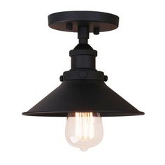 an industrial style light fixture with a black finish and clear glass bulb on the side