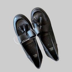 Elevate Your Shoe Game With These Stylish Black Tassel Loafers From Wild Fable's Mallory Collection. The Faux Leather Upper Material Gives These Shoes A Sleek And Sophisticated Look, While The Tasseled Accents Add A Touch Of Bohemian Flair. These Shoes Are Perfect For Any Occasion, Whether You're Dressing Up For A Night Out Or Keeping It Casual During The Day. With Their Versatile Style And High-Quality Construction, These Wild Fable Mallory Loafers Are A Must-Have Addition To Any Woman's Shoe C Black Tassel Slip-on Loafers, Black Tassel Loafers For Workwear In Spring, Black Tassel Loafers For Spring Workwear, Black Tassel Loafers For Office In Spring, Black Tassel Loafers For Spring Office Wear, Black Tassel Loafers For Office Spring Season, Black Tassel Loafers With Round Toe For Spring, Black Flat Tassel Loafers With Brogue Detailing, Casual Black Tassel Loafers With Round Toe