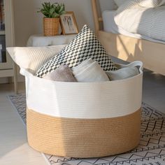 a basket that has some pillows in it