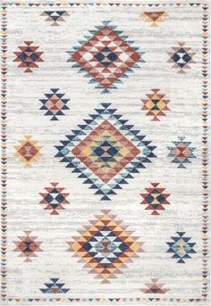 an area rug with multicolored geometric designs on the front and back of it