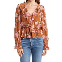 Spring Florals Are Here! The Deets: Ruffle Vneck Floral Blouse | Size Xs | Color: Burnt Orange + Gorgeous Pink/White Floral Print Throughout | Perfectly Paired For The Office W. A Pencil Skirt Or Pants Or Casual Cute For Date Night Or Brunch W. Your Fav Denim | Features: Ruffle V Neck + Sheer Balloon Sleeves + Elastic Drawstring Waist + Lined Throughout Minus The Sleeves + Fits Up To A Small + Machine Washable On Delicate | 17” Bust + 22” Length | 100% Polyester | Contact For Questions | No Trad Chic Floral Print V-neck Top, Pink V-neck Blouse With Ruffles, Fall V-neck Top With Ruffle Hem, Feminine V-neck Blouse For Brunch, Feminine V-neck Tops For Brunch, Feminine V-neck Top For Day Out, Pink Ruffled V-neck Blouse, Spring V-neck Top With Ruffle Hem, Spring V-neck Blouse With Ruffle Hem