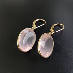 ITEM DESCRIPTION: >> The earrings are made from Solid 14K Yellow Gold. Gemstone used is absolutely natural and ethically sourced. >> Natural Rose Quartz in oval shape and bezel setting is studded on it with utmost precision with Lever back closure. >> This is a minimalist design and is absolutely hassle-free and everyday jewelry. Gem: Rose Quartz Gem size: 13x18 mm Gem weight: 26.65 carats Gold purity: 14K (58.33% approx.) Gold weight: 1.33 grams Gross weight: 6.66 grams The Gold purity is guara Pink Formal Hoop Earrings In Fine Jewelry Style, Pink Hoop Earrings For Formal Occasions, Classic Rose Gold Gemstone Earrings, Pink Round Hoop Earrings For Formal Occasions, Pink Round Hoop Earrings For Formal Events, Luxury Rose Gold Oval Earrings, Elegant Gemstone Hoop Earrings For Formal Occasions, Elegant 14k Gold Gemstone Hoop Earrings, Elegant Pink Gold Hoop Earrings