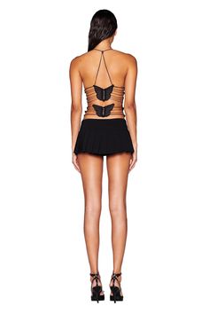 Details Best-selling Ellery style in an all new top style Black mesh top that skims the body and finishes in a straight hem Halter neck style with an adjustable silver bead detail at back neck to tighten or loosen as needed V-neckline with triangle bust cups Gathered detail along the bottom of the bust cups Exposed open back with multiple strapping detail Featuring two custom black butterfly details at back that connect with waist and back ties Partially lined. This style is slightly sheer We re Edgy Halter Neck Top For Clubs, Black Mesh Top For Summer Evenings, Edgy Black Mesh Top For Club, Black Tops With Built-in Bra For Club, Edgy Backless Party Top, Black High Stretch Backless Top, High Stretch Black Halter Neck Tops, Black High Stretch Mesh Top For Spring, Edgy Fitted Mesh Top For Night Out