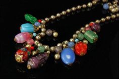 "This is a very beautiful, unique and vintage MODERN BEADS ART GLASS CHARMS FAUX PEARL BRASS c. 1950 dangle necklace. The necklace has marvelous modern style art glass charms, beads, faux pearls and brass. The necklace has a very exotic and elegant feel to it. It measures 20 3/4\" long. The necklace is in good condition. 0.7 BR" Filigree Ring Gold, Beads Art, Good Luck Necklace, Art Perle, Dangle Necklace, Gold Link Bracelet, Glass Charms, Dangle Necklaces, Silver Choker