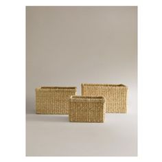 three woven baskets sitting next to each other