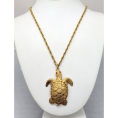 This is part of Chairish’s Costume Jewelry assortment.  1960s goldtone turtle with small round faux-garnet eyes and articulated neck (which moves with movement, giving it a lifelike effect) necklace with spring ring clasp. Marked "NAPIER" on the spring ring that the clasp attaches to. Pendant without bale measures: 2 1/4 inches long by 1 3/4 inches. Chain doubled measures: 12 inches long. Condition: Very good; minor wear to back of the pendant. Gold-tone Metal Jewelry Collectible, Gold-tone Metal Jewelry For Collectors, Collectible Gold-tone Pendant Jewelry, Collectible Gold-tone Brass Jewelry, Vintage Gold-tone Jewelry With Lobster Clasp, Vintage Gold-tone Pendant Jewelry, Collectible Brass Costume Jewelry Necklaces, Heart Necklace Tiffany, Crescent Moon Necklace Gold