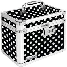 a black and white polka dot suitcase with silver trimmings on the lid,